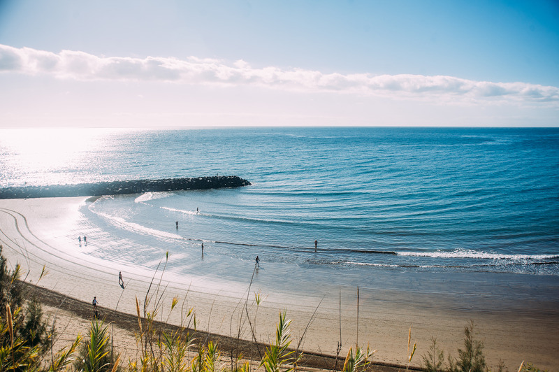 Playa del ingles a body of water with buildings around it