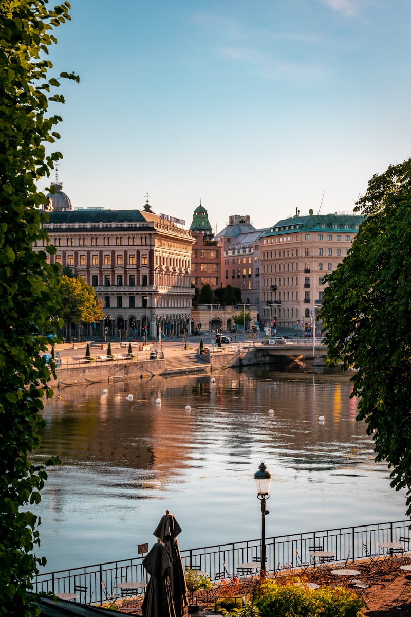 Photo by Tom Podmore a body of water with buildings around it